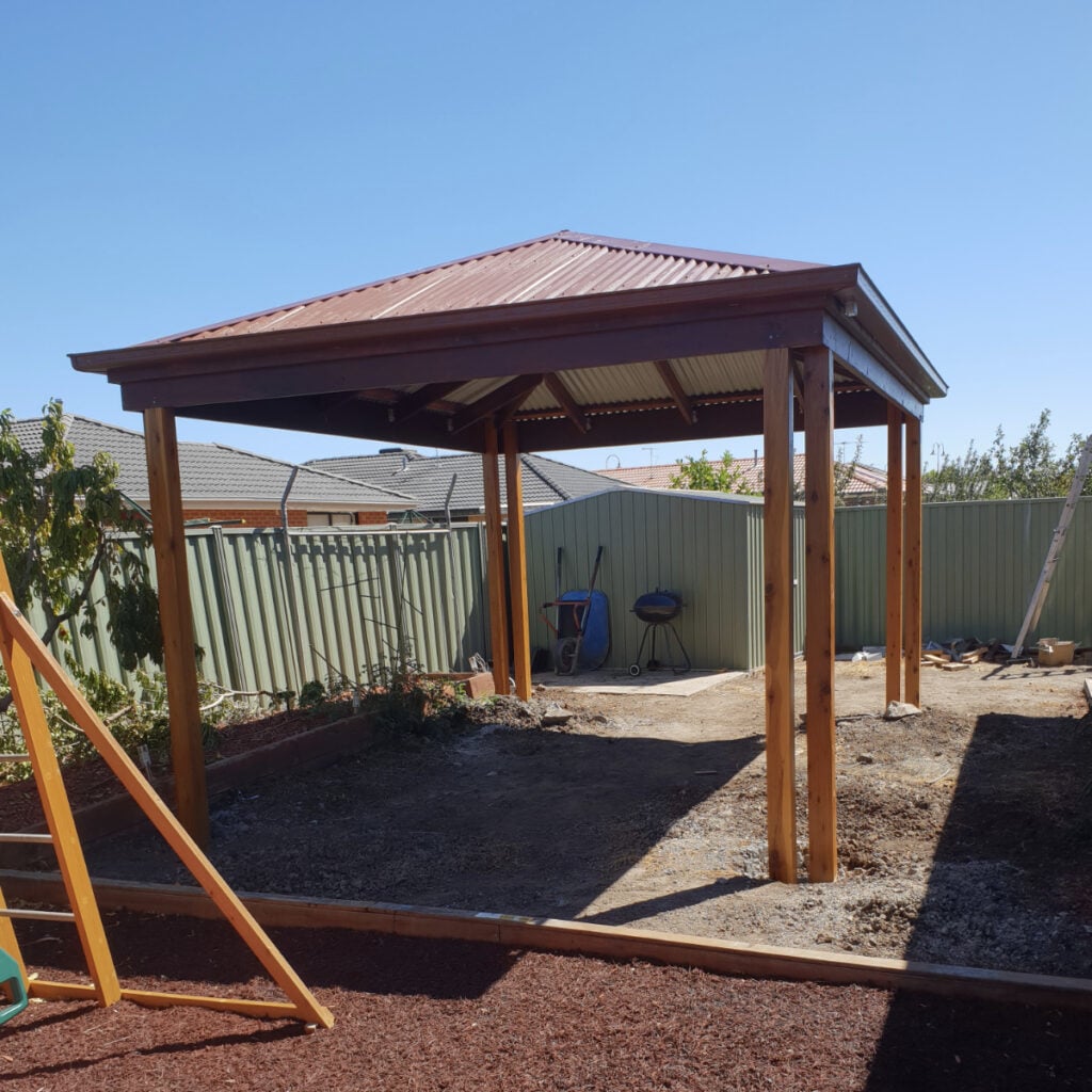 Standalone pergola next to playground.